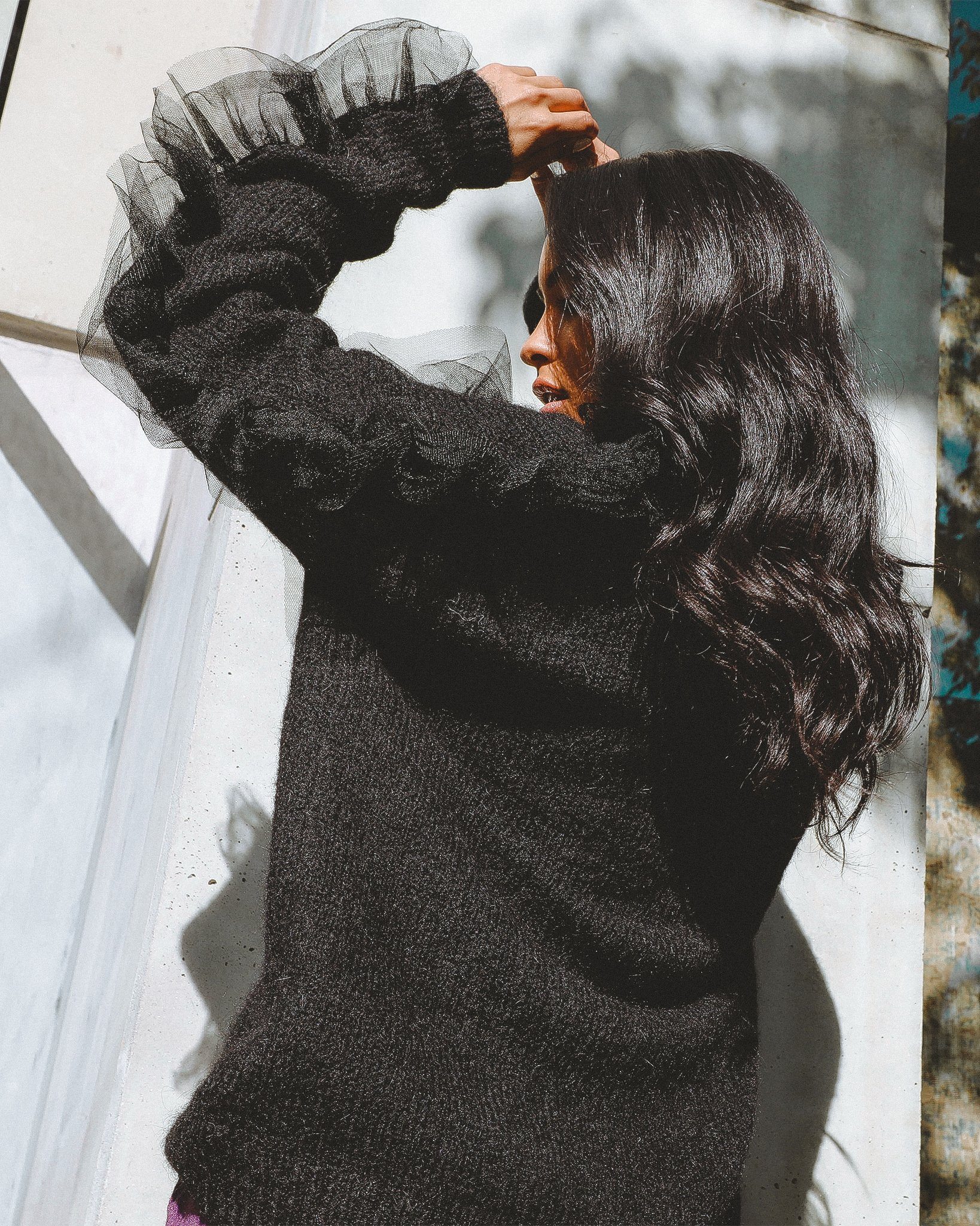 Collette Wool Blend Cardigan featuring ruffled organza sleeves and a v-neckline, styled casually.