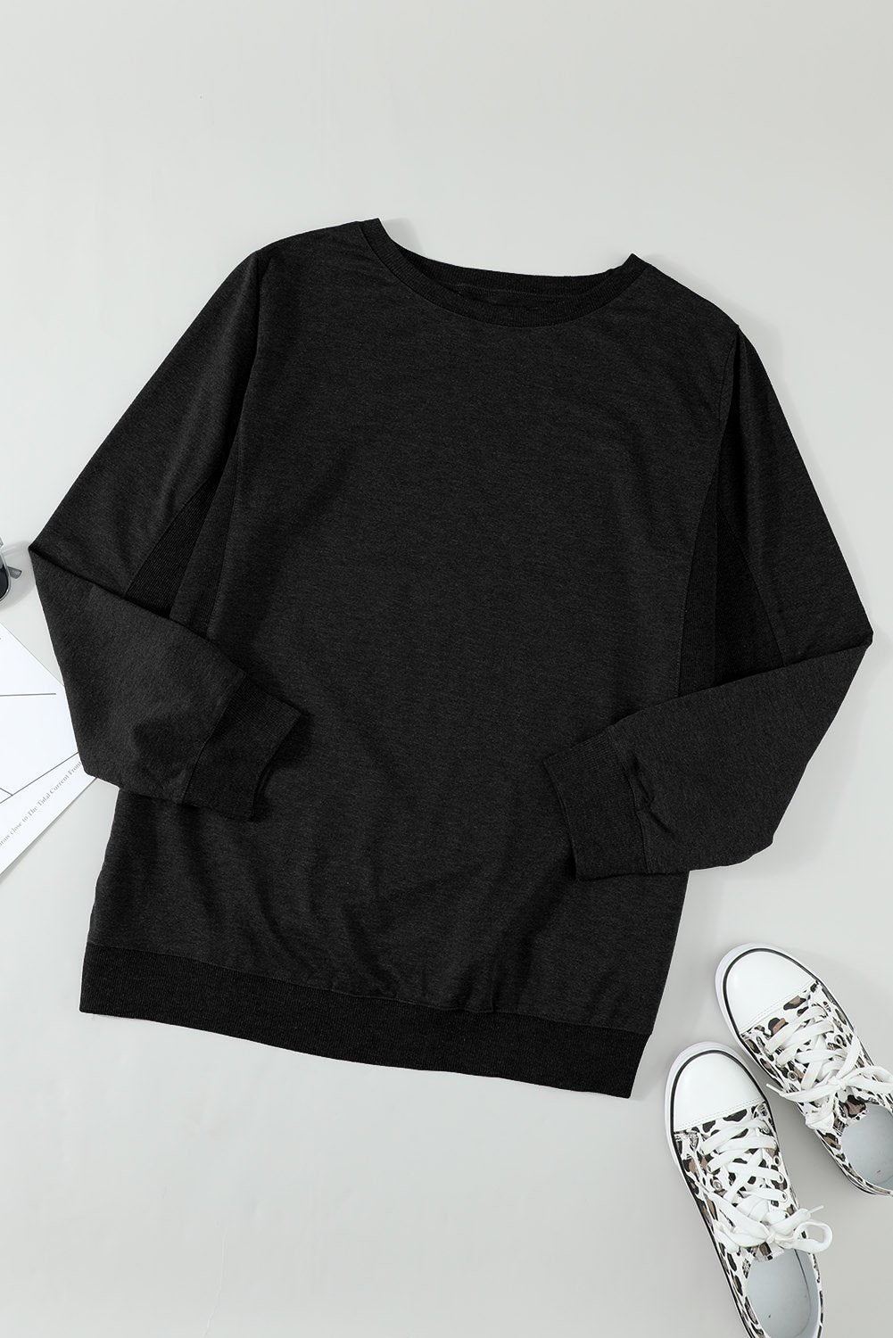 A black Comfy Wash Fleece Sweatshirt with full sleeves and a round neckline, showcasing its soft fleece material and casual style.