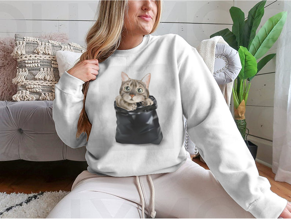 Illustration of a cute cat peeking out from a black trash bag, showcasing a whimsical and playful design.