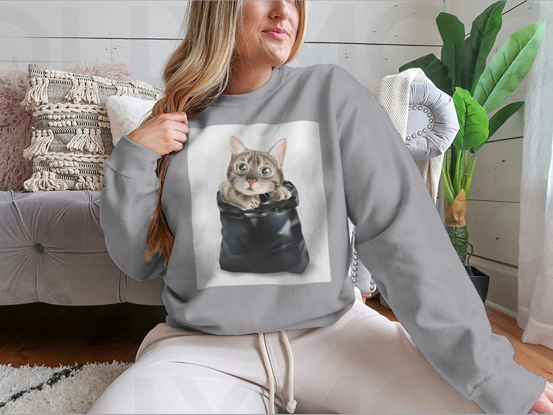 Illustration of a cute cat peeking out from a black trash bag, showcasing a whimsical and playful design.