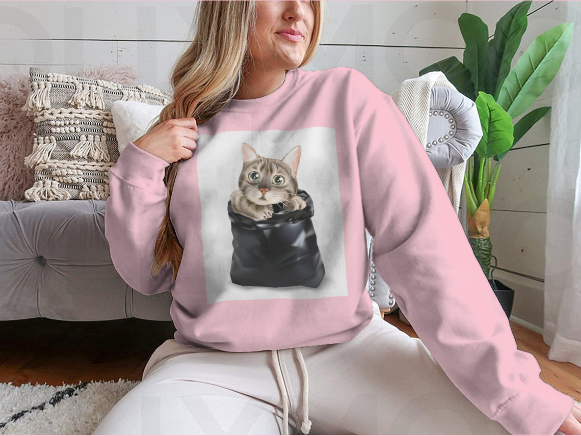 Illustration of a cute cat peeking out from a black trash bag, showcasing a whimsical and playful design.