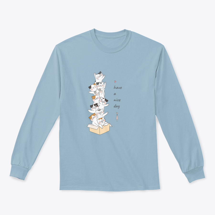 A cute vector illustration of a cat in a brown box with the text 'Have A Nice Day' on a soft t-shirt.