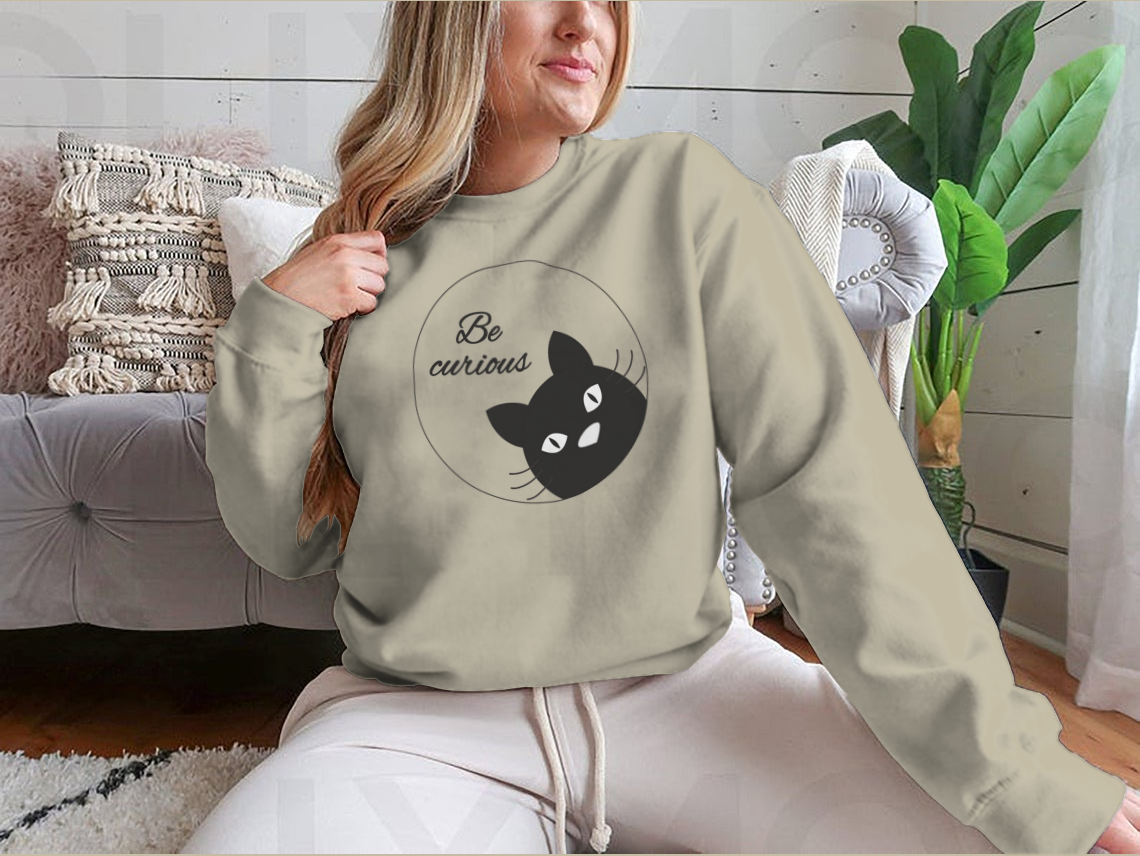 A cute black cat face cartoon character design on a greeting card, showcasing its playful and charming features.