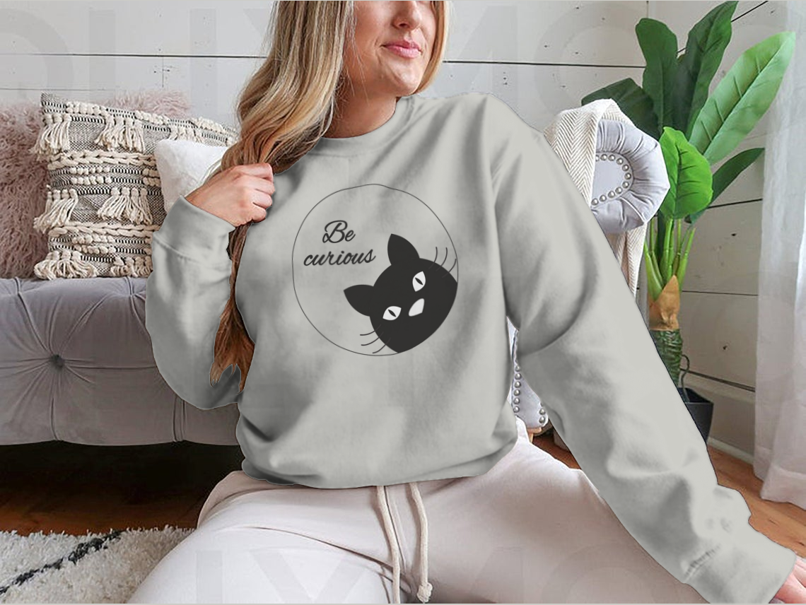 A cute black cat face cartoon character design on a greeting card, showcasing its playful and charming features.