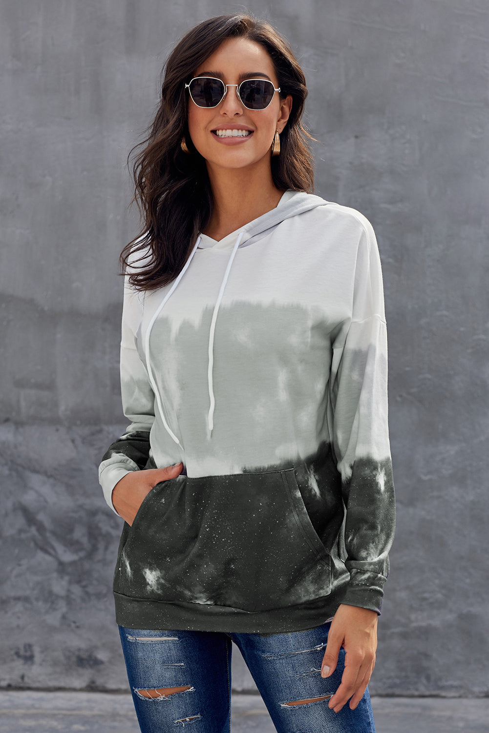 Gray tie dye gradient long sleeve pullover hoodie with adjustable drawstring and kangaroo pocket.