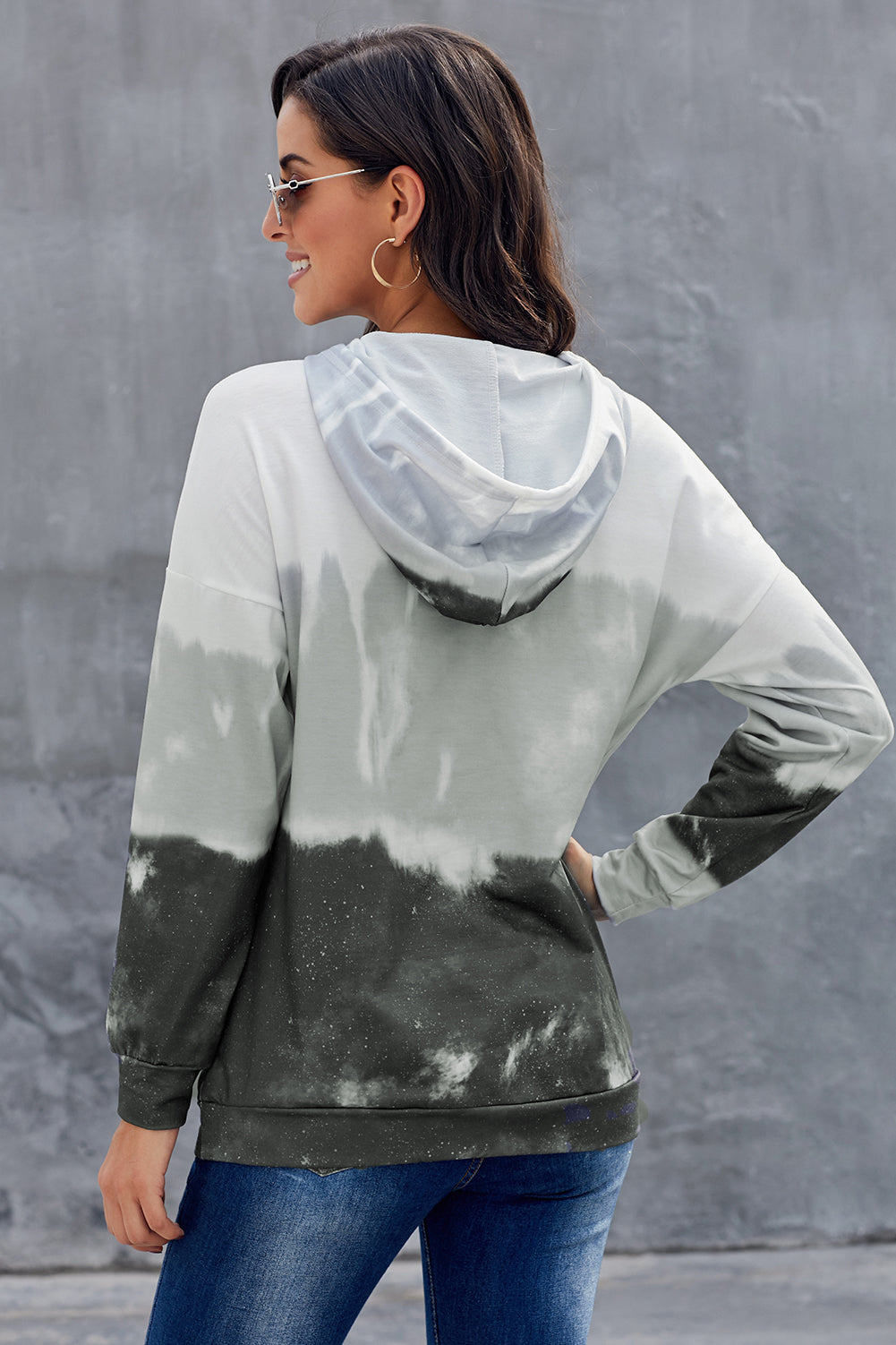 Gray tie dye gradient long sleeve pullover hoodie with adjustable drawstring and kangaroo pocket.