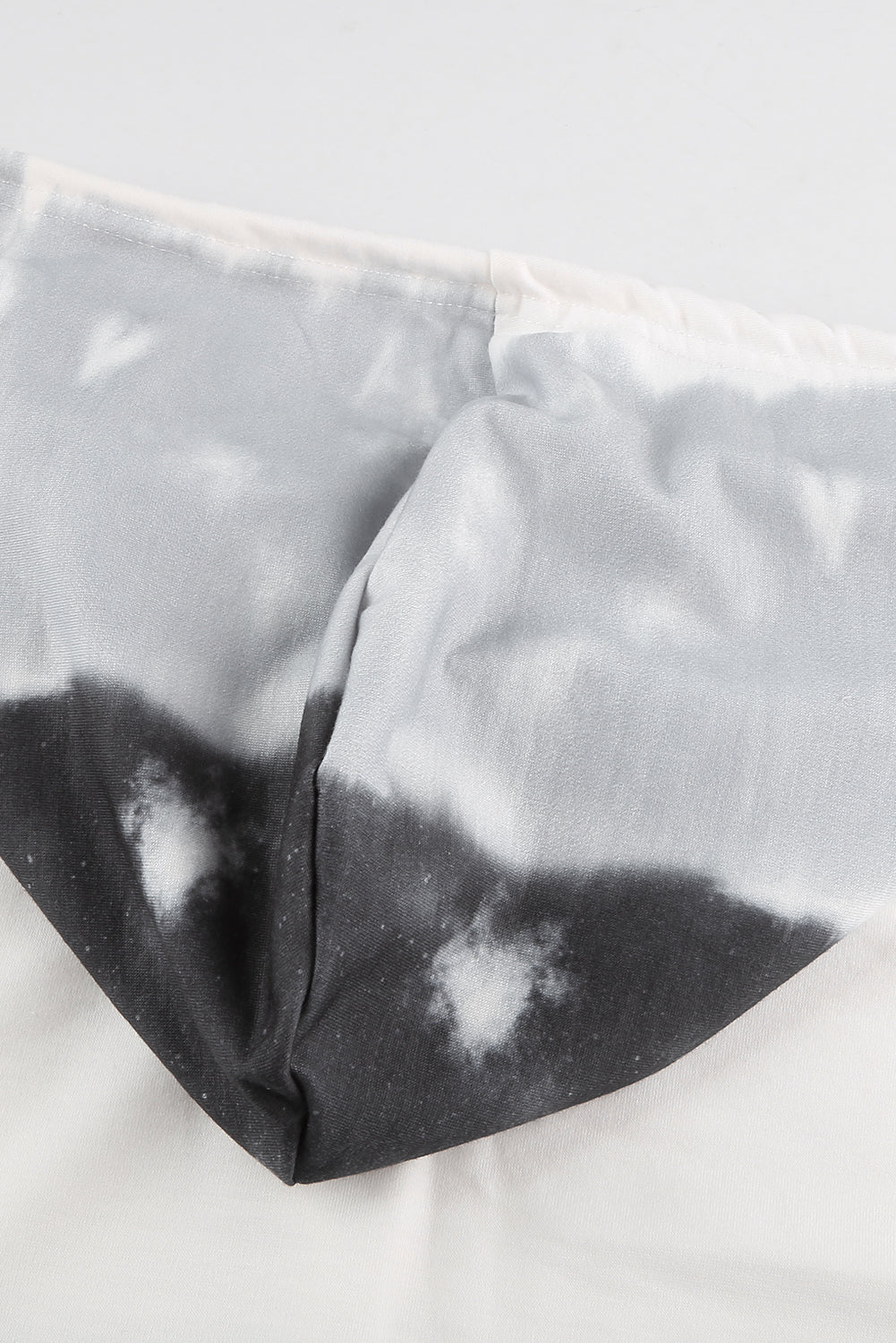 Gray tie dye gradient long sleeve pullover hoodie with adjustable drawstring and kangaroo pocket.