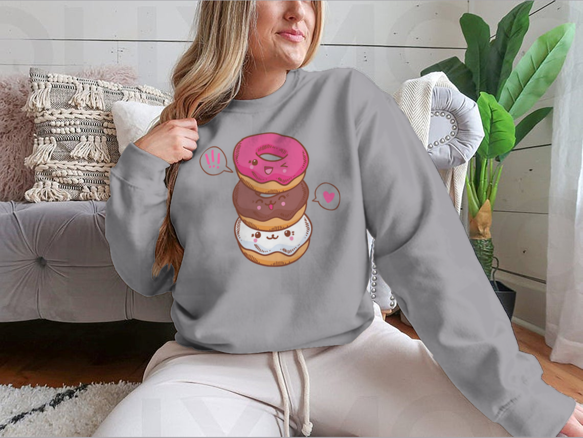 A colorful illustration of three cute kawaii donuts, perfect for T-shirt design, showcasing their playful and vibrant features.