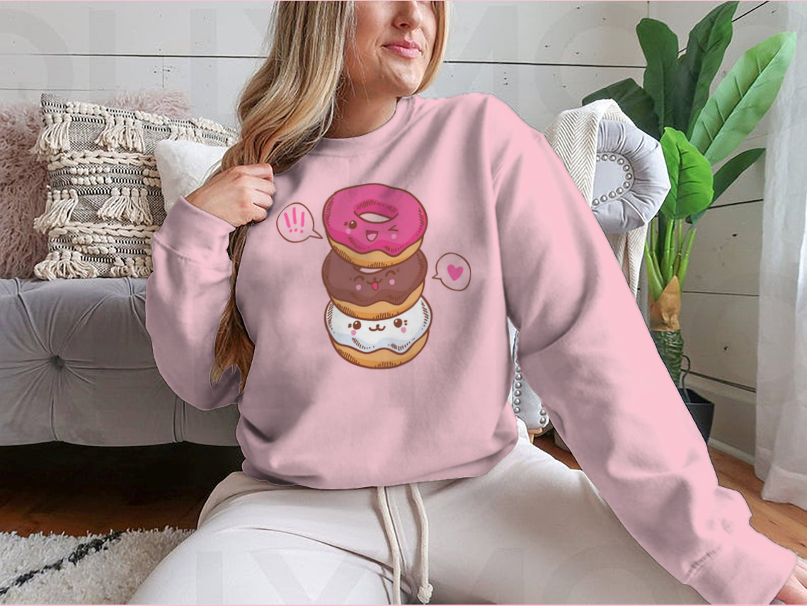A colorful illustration of three cute kawaii donuts, perfect for T-shirt design, showcasing their playful and vibrant features.