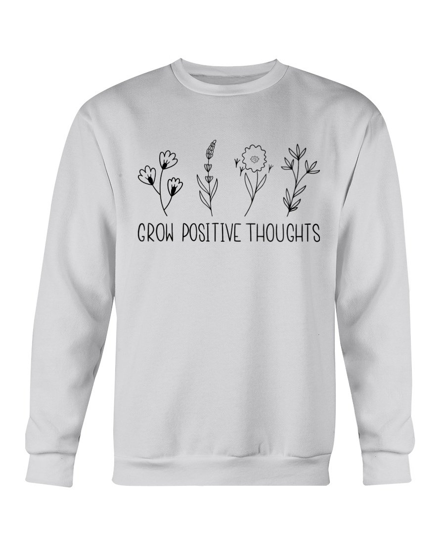 A cozy Gildan crewneck sweatshirt featuring the phrase 'Grow Positive Thoughts' in a stylish font, perfect for casual wear.