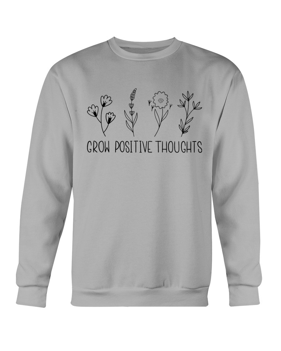 A cozy Gildan crewneck sweatshirt featuring the phrase 'Grow Positive Thoughts' in a stylish font, perfect for casual wear.