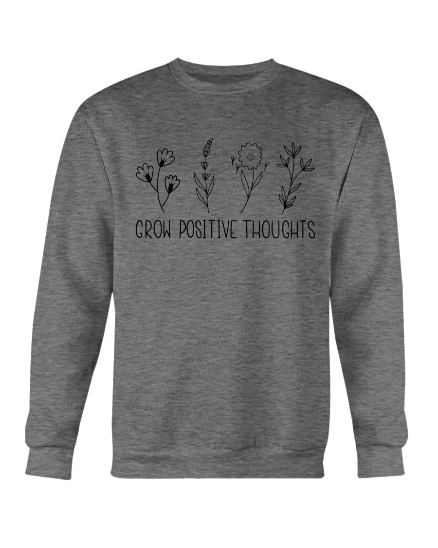 A cozy Gildan crewneck sweatshirt featuring the phrase 'Grow Positive Thoughts' in a stylish font, perfect for casual wear.
