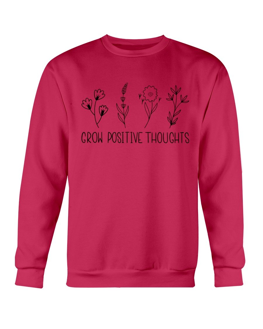 A cozy Gildan crewneck sweatshirt featuring the phrase 'Grow Positive Thoughts' in a stylish font, perfect for casual wear.