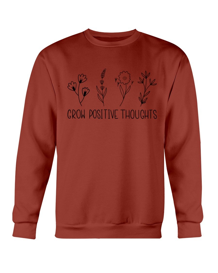 A cozy Gildan crewneck sweatshirt featuring the phrase 'Grow Positive Thoughts' in a stylish font, perfect for casual wear.