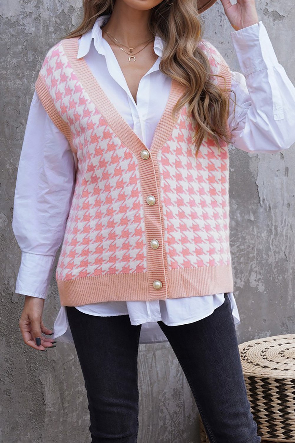 A stylish Houndstooth Vest Cardigan featuring a timeless pattern, button closure, and sleeveless design, available in black, green, and pink.
