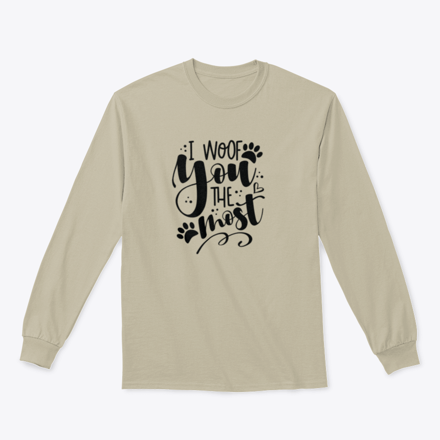 A humorous T-shirt featuring the phrase 'I Woof You The Most' with a cute paw print design, perfect for dog lovers.