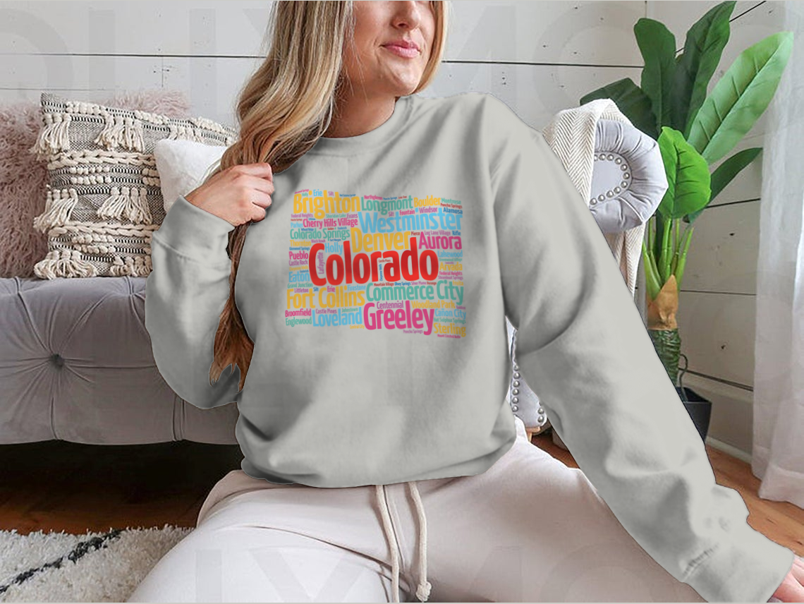 A cozy sweatshirt featuring a list of cities in Colorado, made from 100% cotton, showcasing a classic fit and midweight fabric.