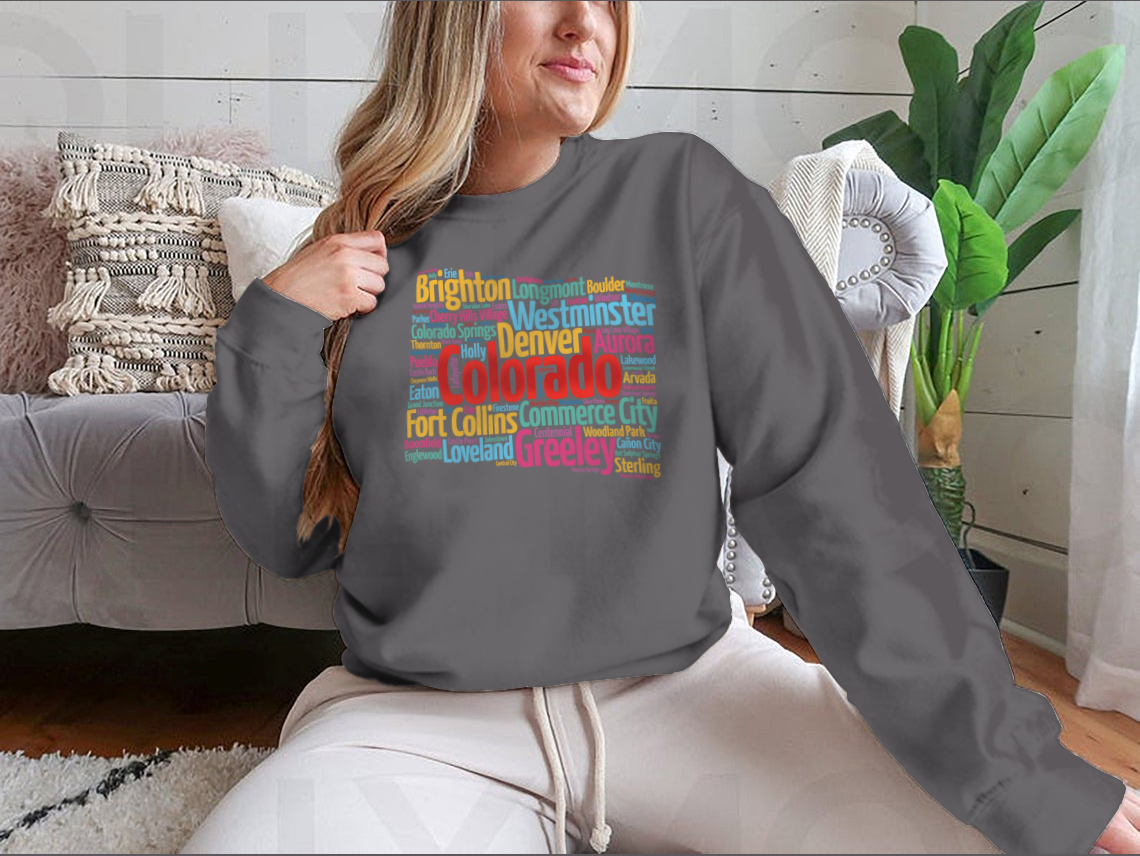 A cozy sweatshirt featuring a list of cities in Colorado, made from 100% cotton, showcasing a classic fit and midweight fabric.