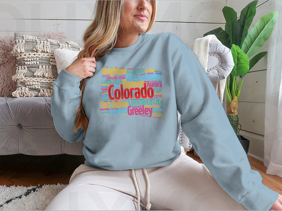A cozy sweatshirt featuring a list of cities in Colorado, made from 100% cotton, showcasing a classic fit and midweight fabric.