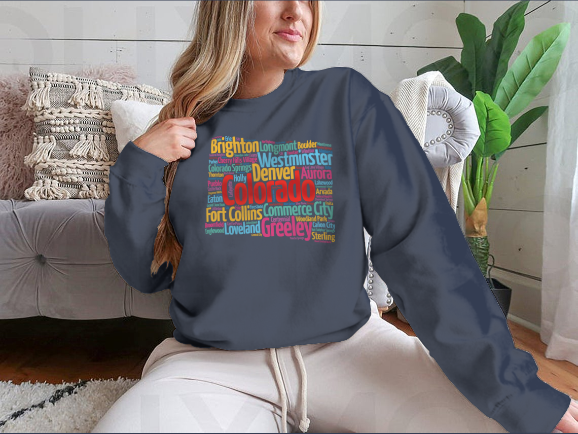 A cozy sweatshirt featuring a list of cities in Colorado, made from 100% cotton, showcasing a classic fit and midweight fabric.