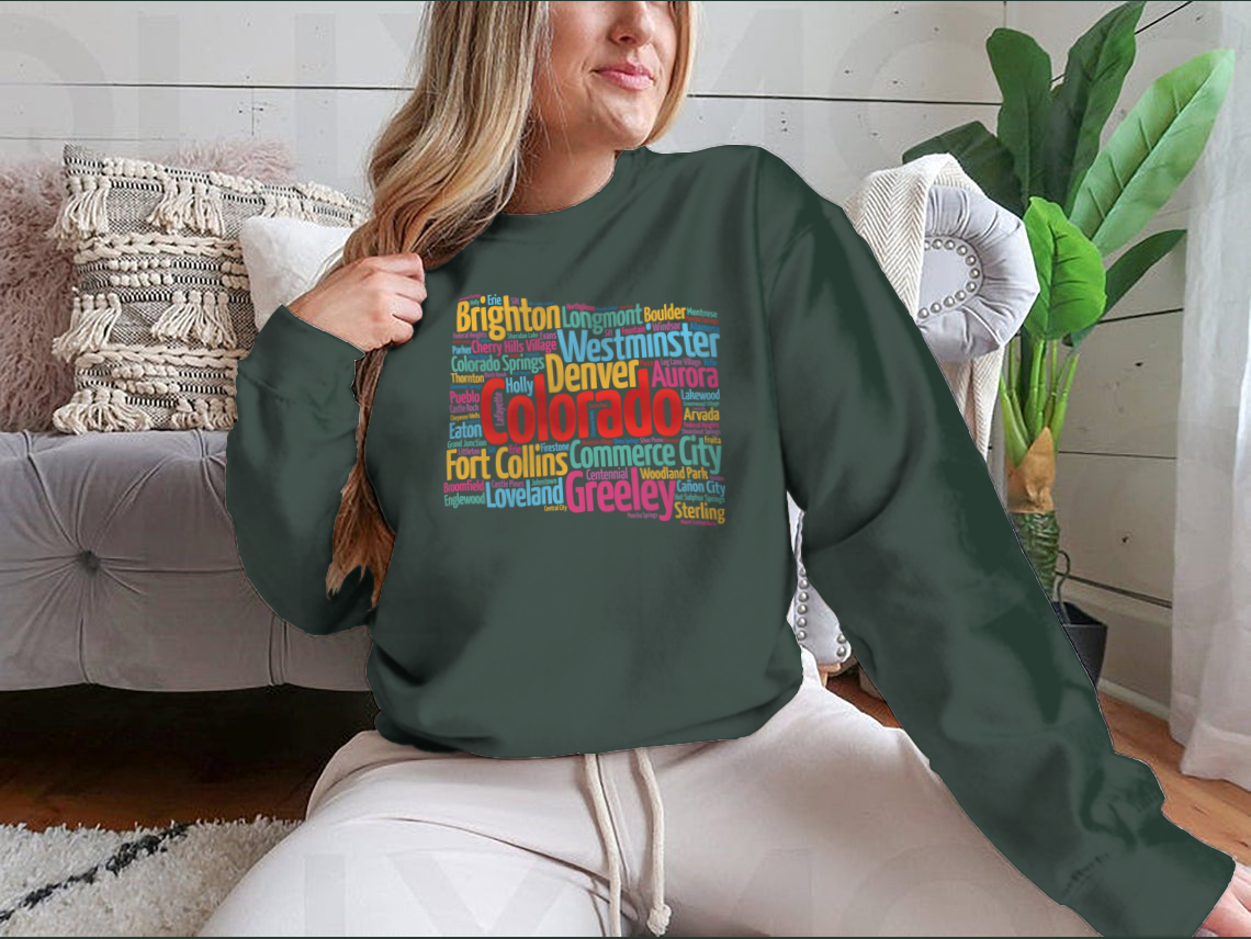 A cozy sweatshirt featuring a list of cities in Colorado, made from 100% cotton, showcasing a classic fit and midweight fabric.