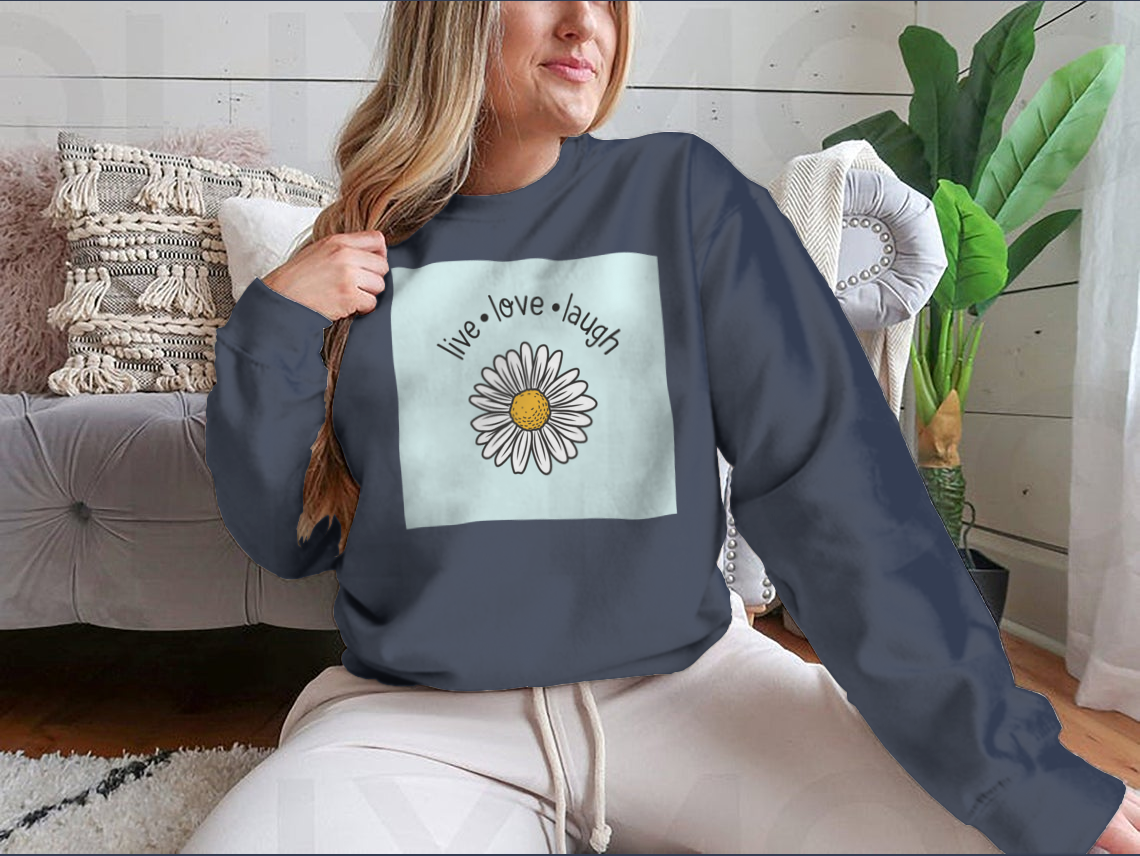 A stylish Live Love Laugh T-shirt featuring a daisy flower vector design, made from soft cotton fabric.