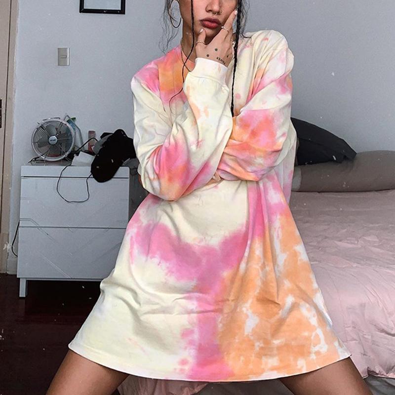 A stylish tie-dye O-neck loose ladies sweatshirt in vibrant colors, showcasing full-length sleeves and a relaxed fit, perfect for casual wear.