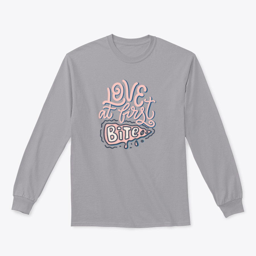 A stylish t-shirt featuring hand-drawn lettering that reads 'Love At First Bite' with a pizza graphic, made from 100% cotton.