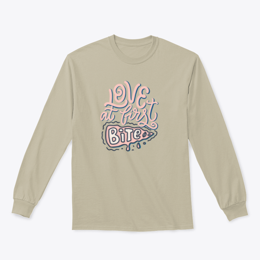 A stylish t-shirt featuring hand-drawn lettering that reads 'Love At First Bite' with a pizza graphic, made from 100% cotton.