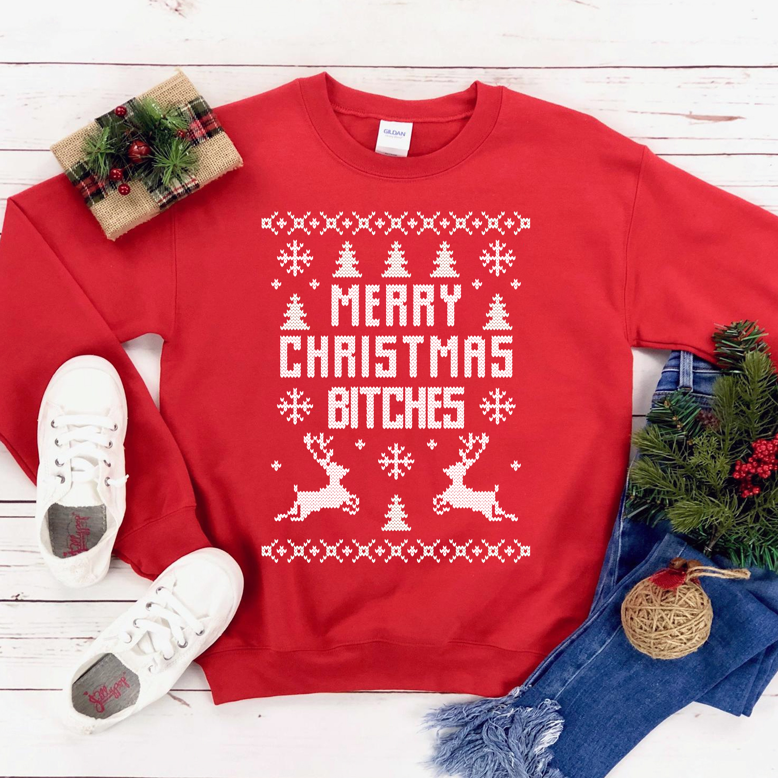 A cozy unisex sweatshirt featuring the phrase 'Merry Christmas Bitches' in festive lettering, perfect for holiday celebrations.