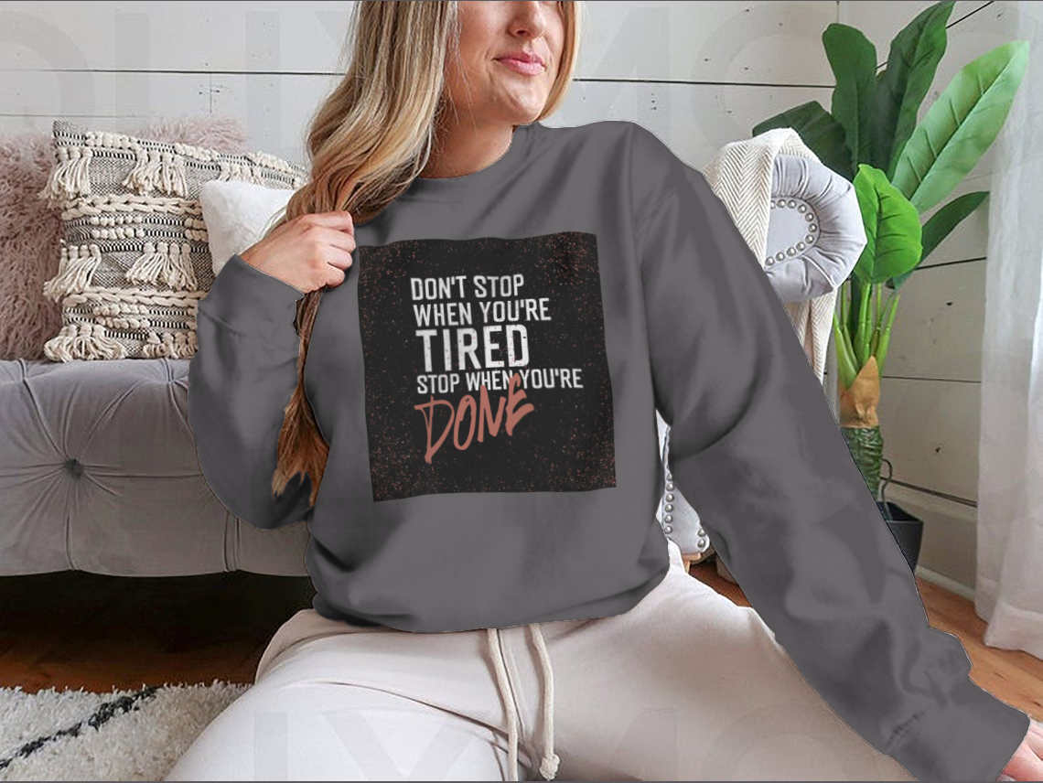 Motivational poster with the quote 'Don't Stop When You're Tired' displayed in a stylish setting, emphasizing inspiration and determination.