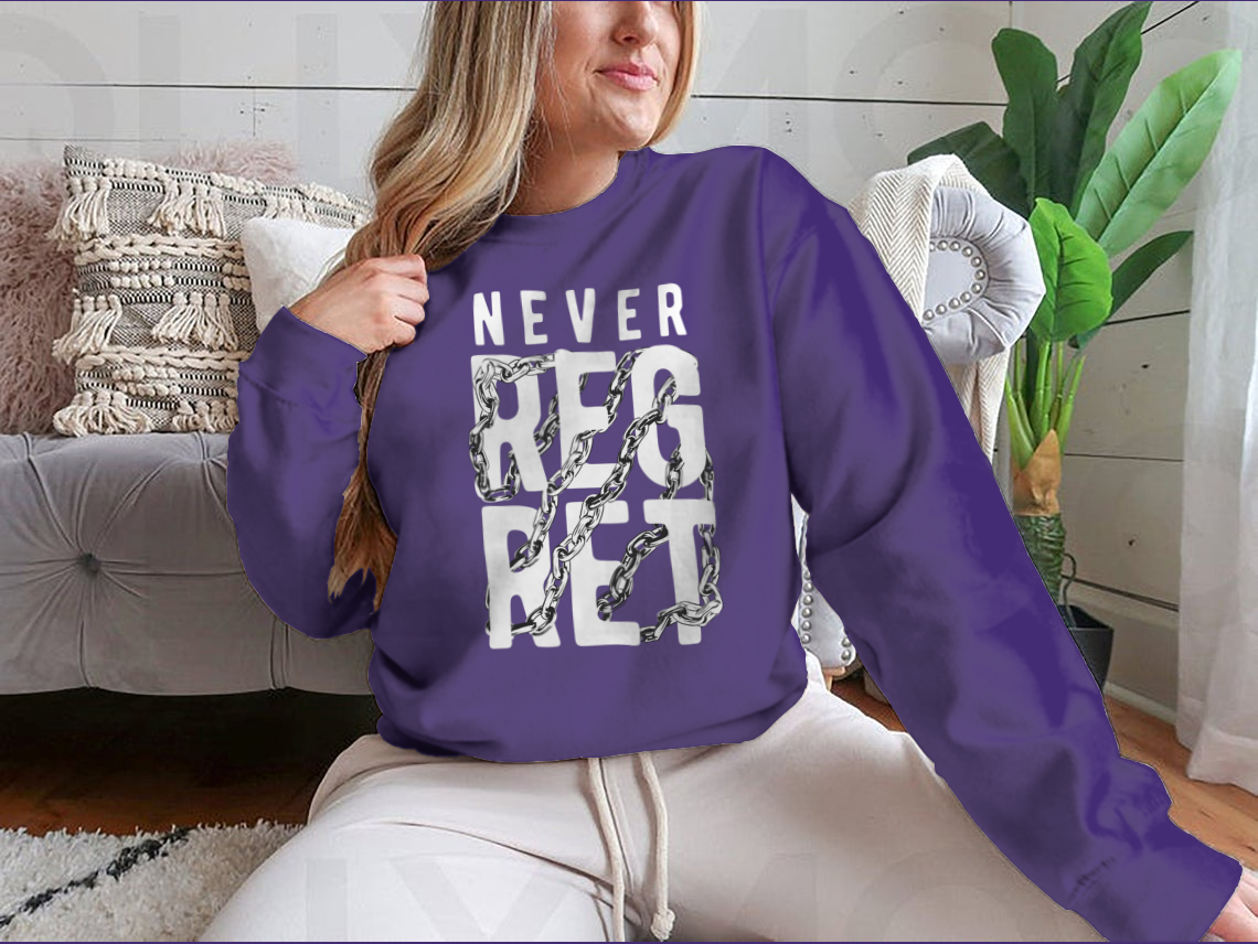 A stylish t-shirt featuring the slogan 'Never Regret' wrapped around by a chain design, made from soft cotton fabric.