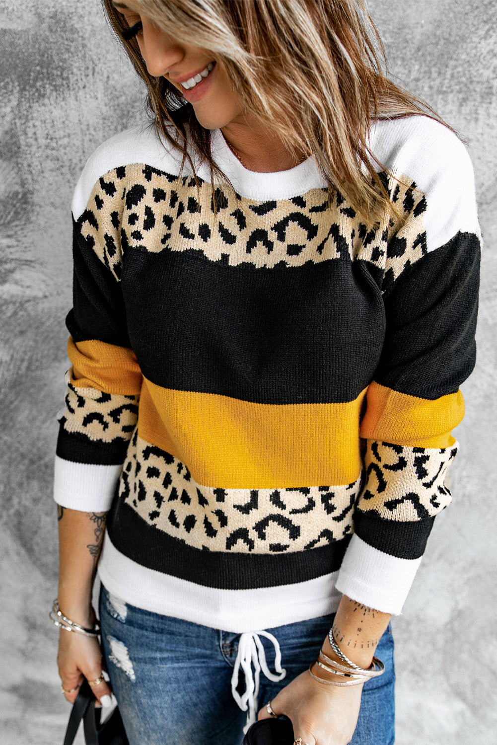 A stylish New Leopard Pullover Sweater featuring a color block design and leopard pattern, perfect for fall and winter wear.