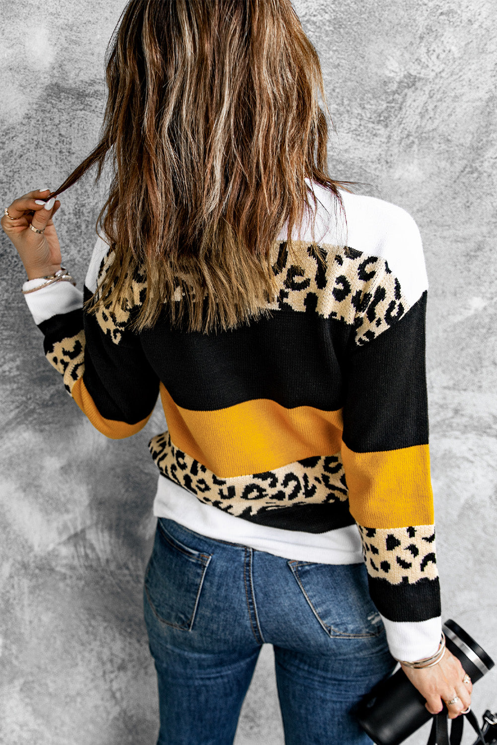 A stylish New Leopard Pullover Sweater featuring a color block design and leopard pattern, perfect for fall and winter wear.