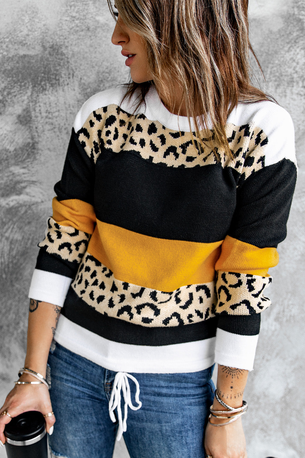 A stylish New Leopard Pullover Sweater featuring a color block design and leopard pattern, perfect for fall and winter wear.