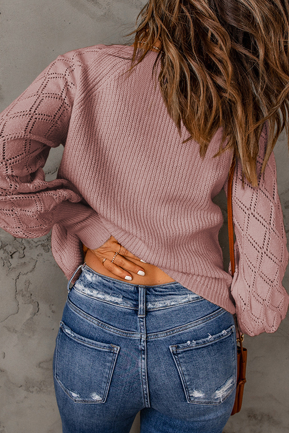 A stylish pink bishop sleeve button sweater featuring a V-neck design, perfect for casual wear in spring and autumn.