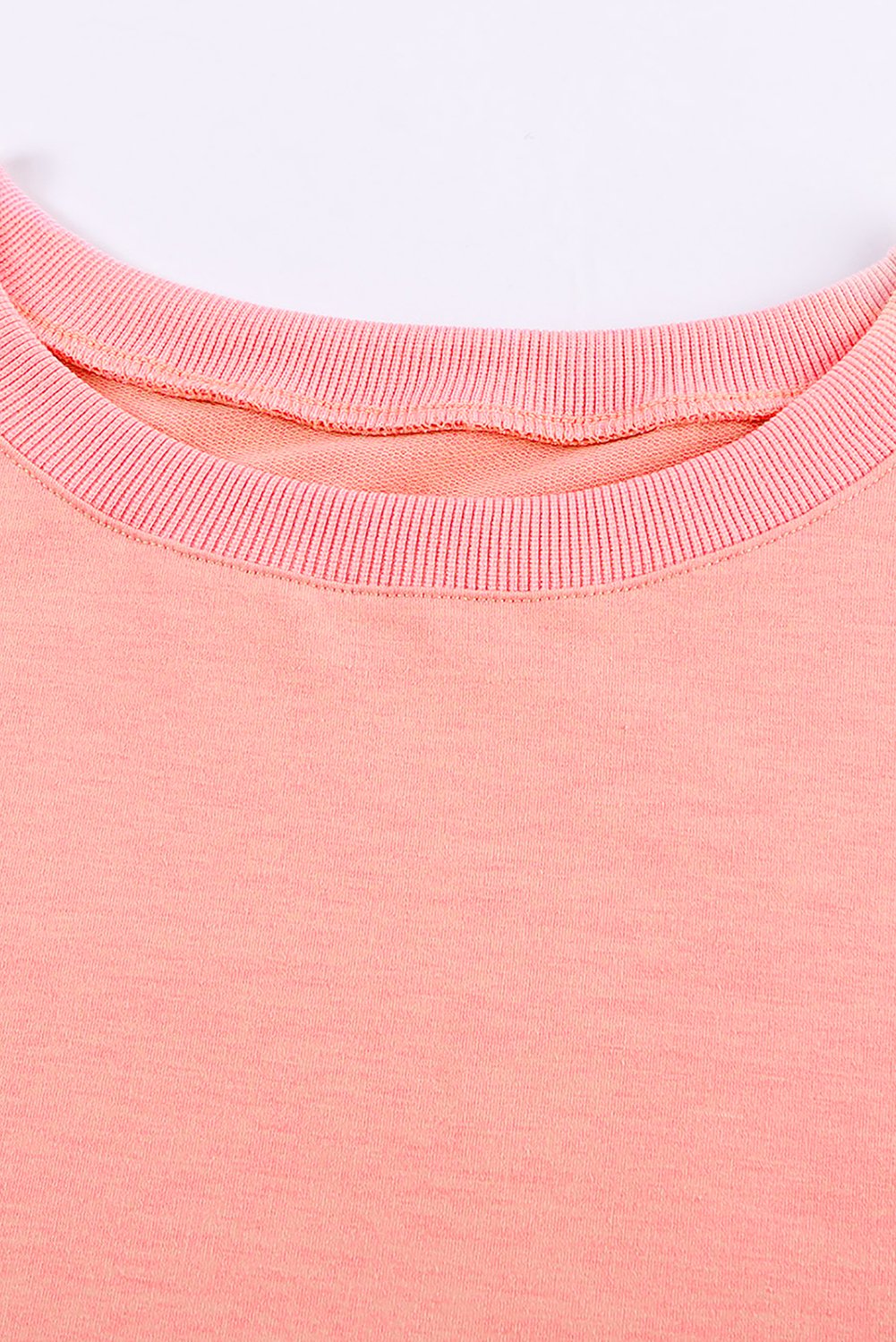 A cozy pink wash fleece sweatshirt with long sleeves, perfect for casual wear in winter, spring, and autumn.