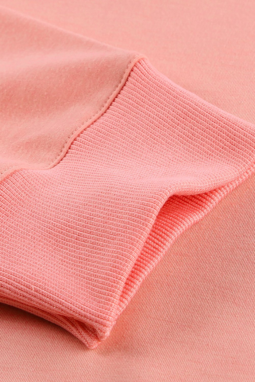 A cozy pink wash fleece sweatshirt with long sleeves, perfect for casual wear in winter, spring, and autumn.