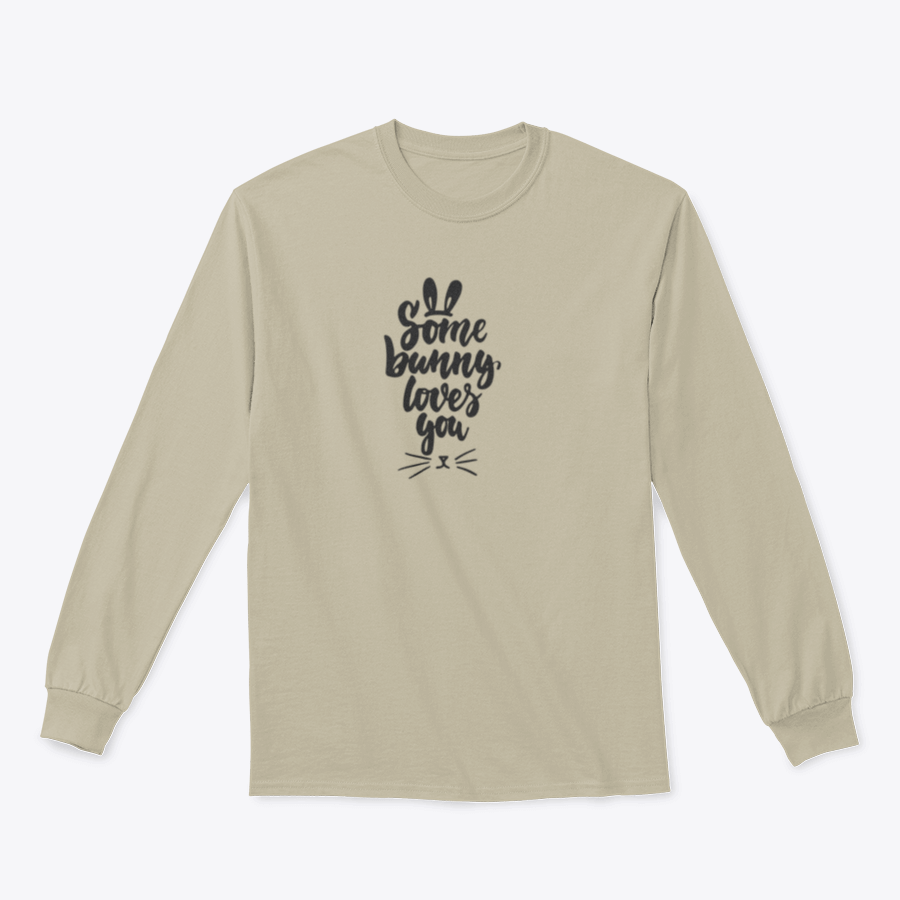 A stylish t-shirt featuring hand-drawn Easter lettering 'Some Bunny Loves You' on a soft cotton fabric, perfect for spring celebrations.