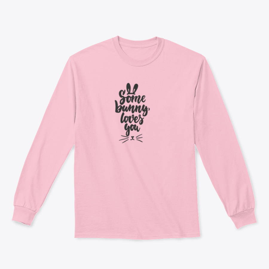 A stylish t-shirt featuring hand-drawn Easter lettering 'Some Bunny Loves You' on a soft cotton fabric, perfect for spring celebrations.