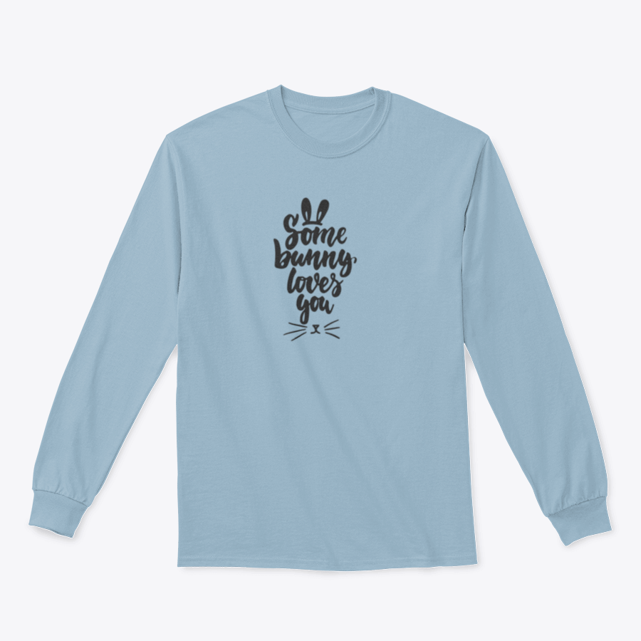 A stylish t-shirt featuring hand-drawn Easter lettering 'Some Bunny Loves You' on a soft cotton fabric, perfect for spring celebrations.