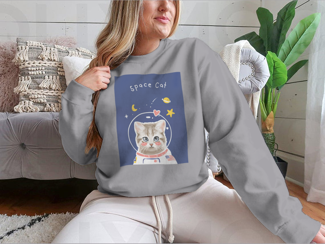 A cute kitten in a cartoon astronaut suit, showcasing the Space Cat Slogan T-shirt design.