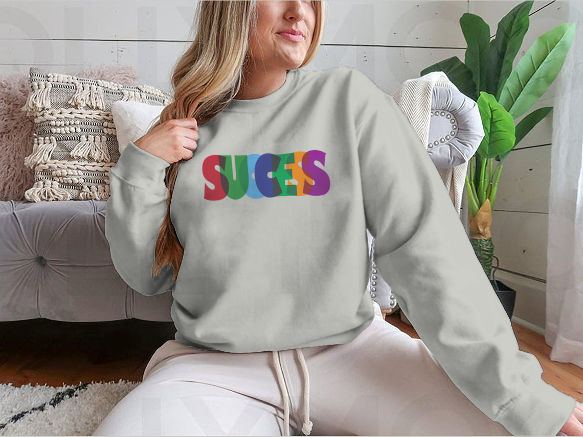 A vibrant t-shirt featuring the word 'Success' in colorful typography, showcasing a stylish design perfect for casual wear.