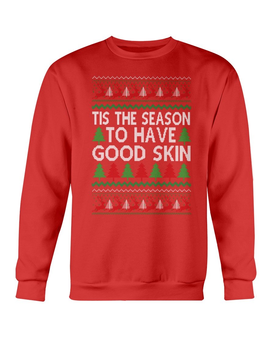 A cozy Gildan crewneck sweatshirt featuring the festive phrase 'Tis the Season to have Good Skin, perfect for Christmas celebrations.