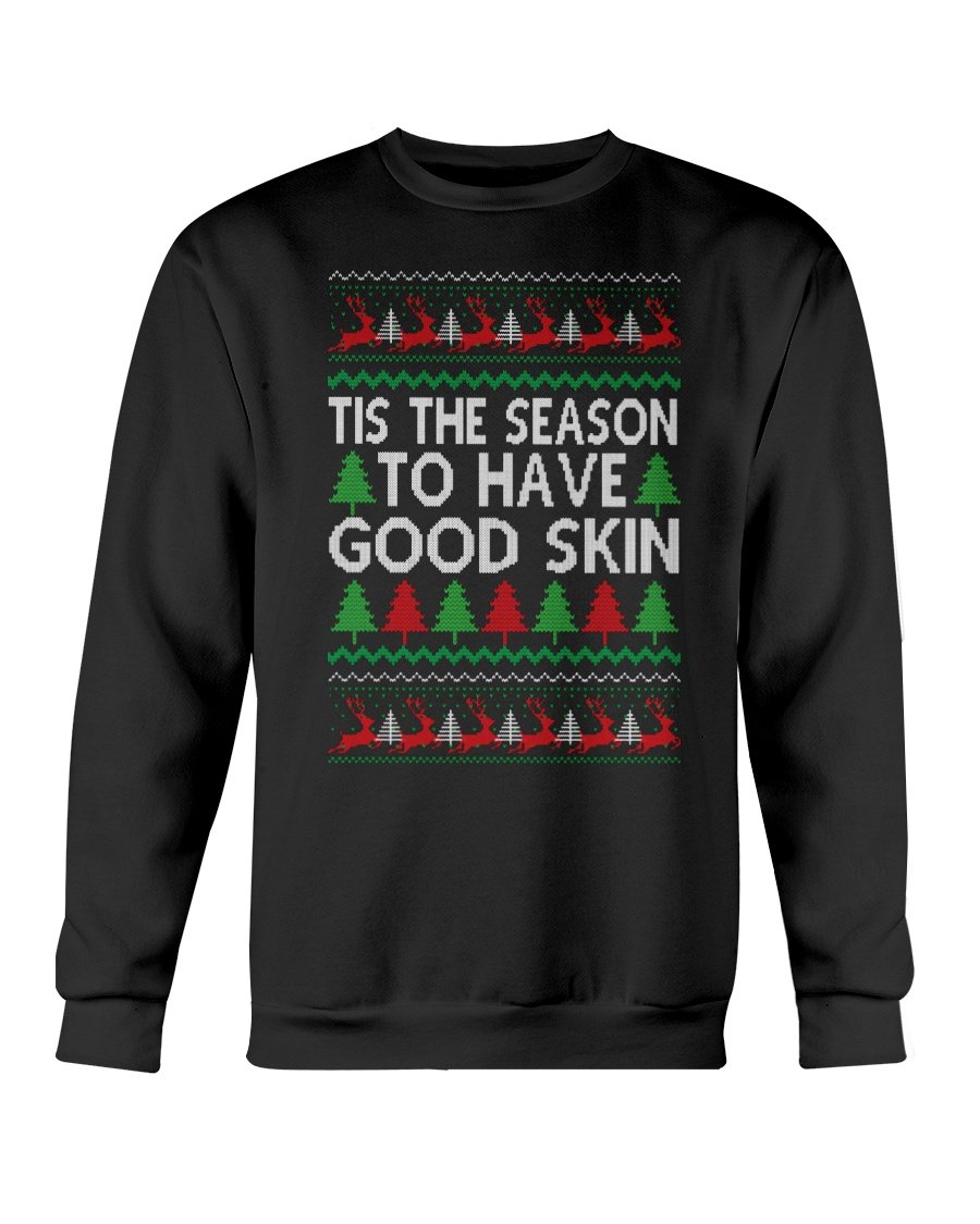 A cozy Gildan crewneck sweatshirt featuring the festive phrase 'Tis the Season to have Good Skin, perfect for Christmas celebrations.