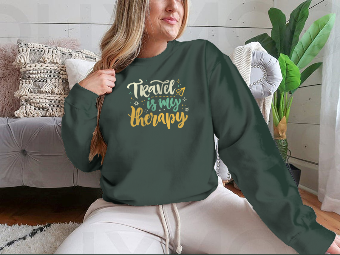 A stylish 'Travel Is My Therapy' shirt design featuring bold lettering, made from soft cotton fabric, perfect for travel enthusiasts.