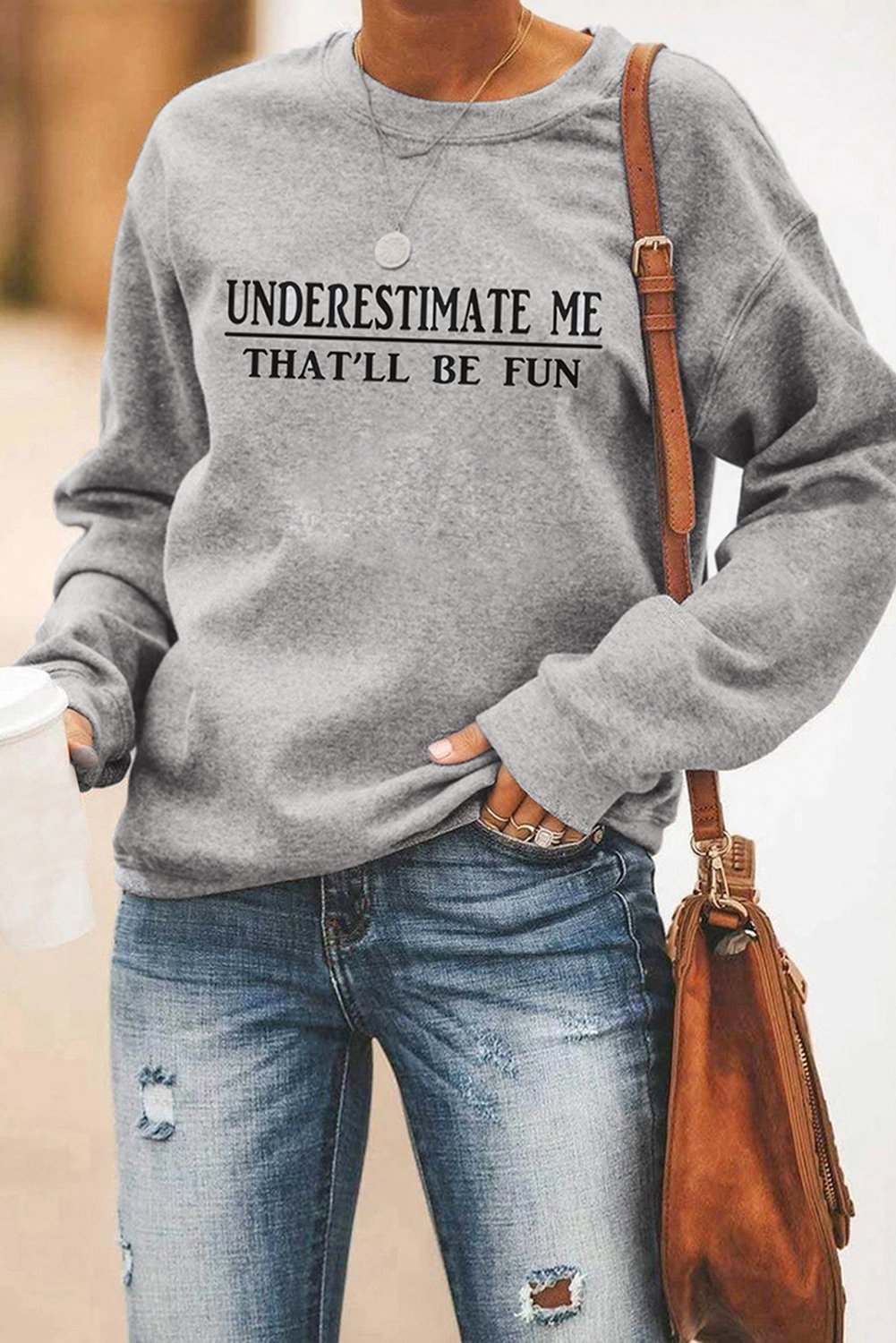 Gray sweatshirt featuring a unique letter print design on the chest, perfect for casual wear.