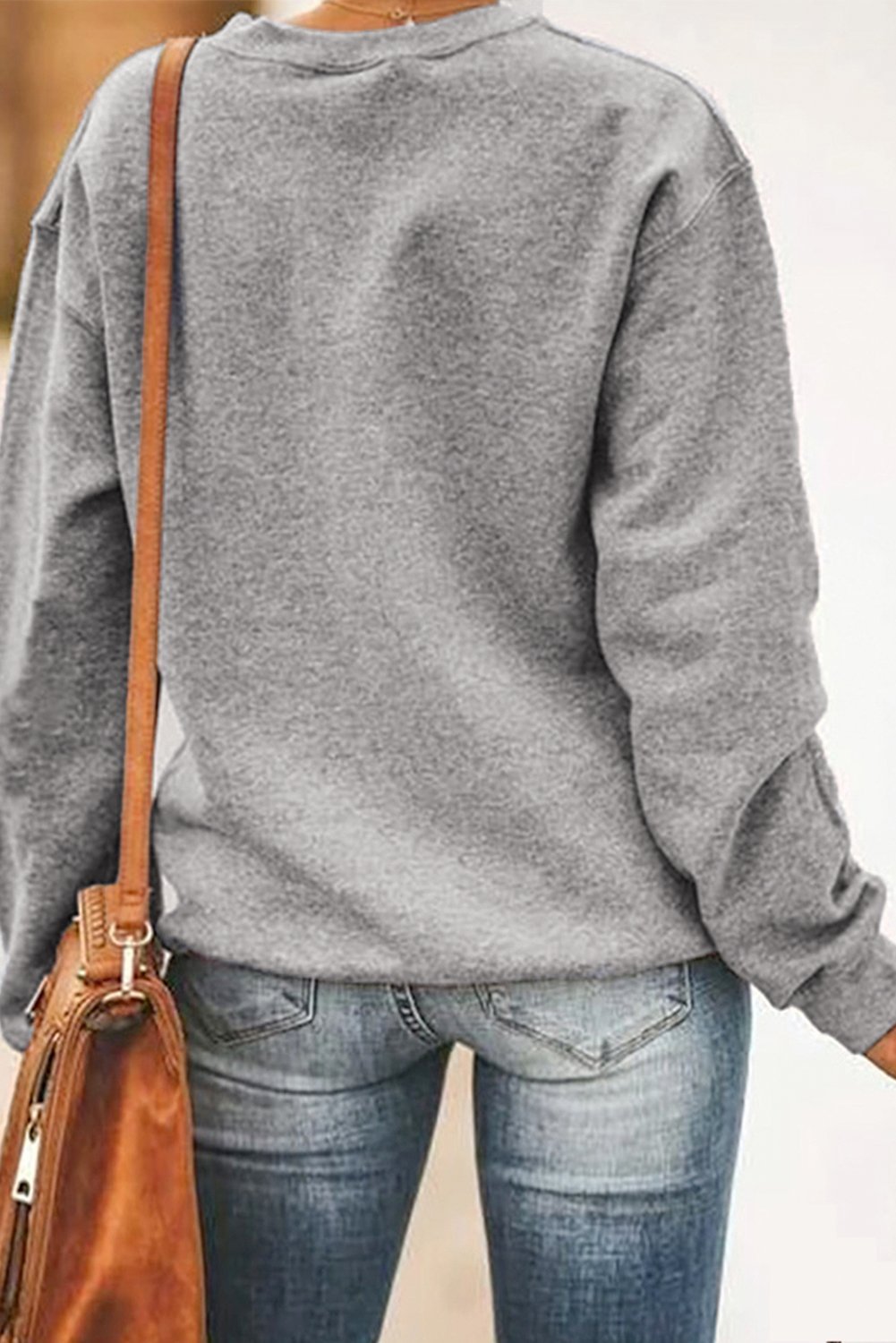 Gray sweatshirt featuring a unique letter print design on the chest, perfect for casual wear.