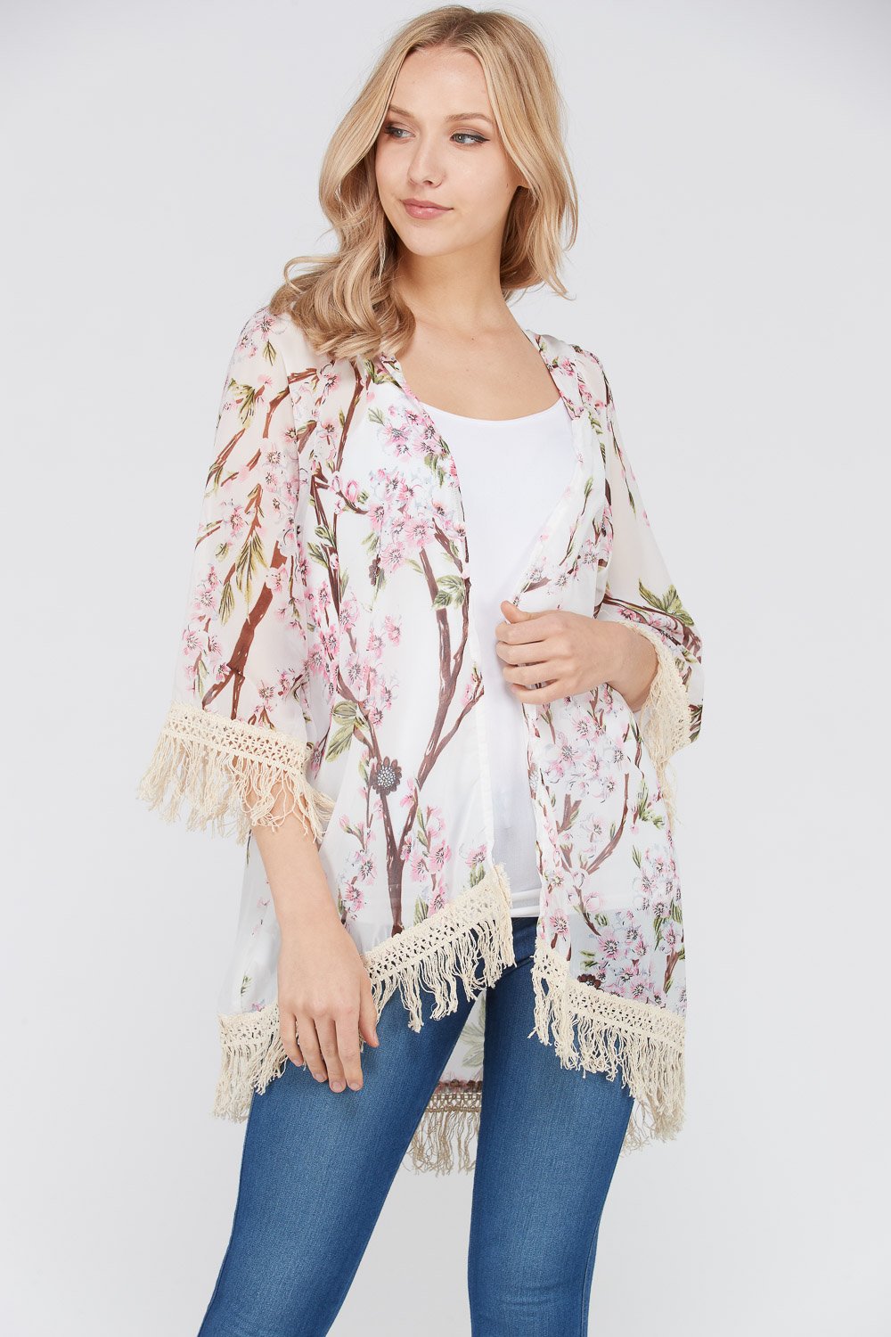 A stylish Women's 3/4 Sleeve Floral Printed Fringe Cardigan featuring a vibrant floral pattern and trendy fringe detailing at the bottom.