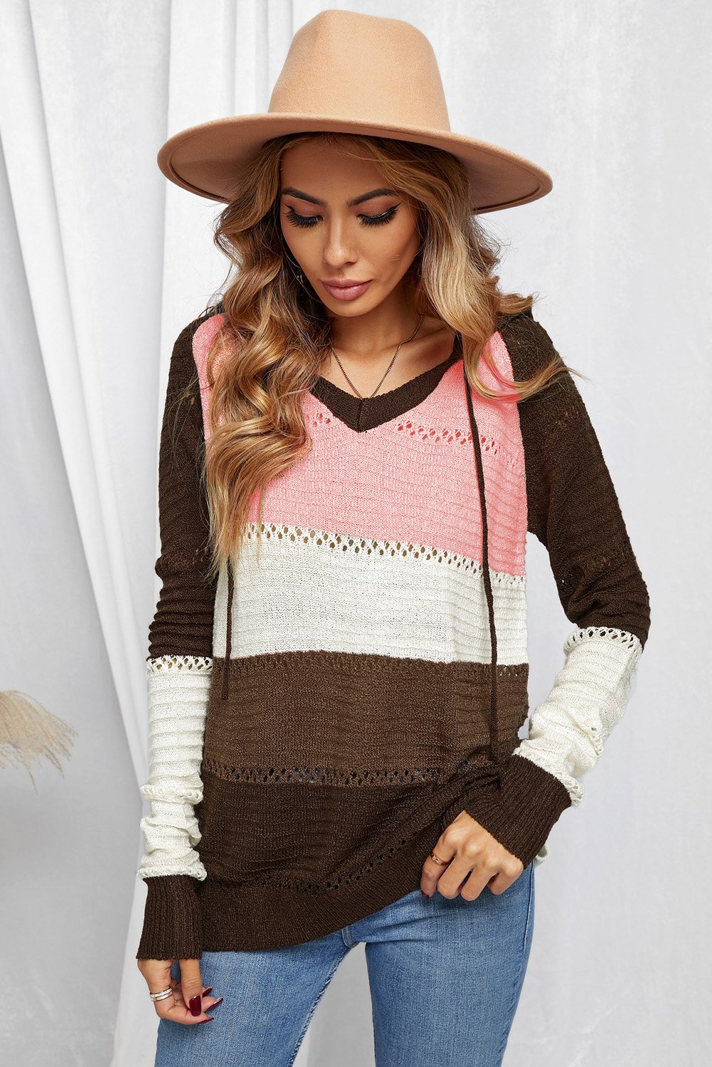 Women's Brown Beach Bonfire Knitted Hoodie displayed on a mannequin, showcasing its stylish design and cozy fabric.